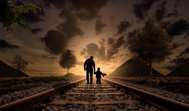 father and son on railroad